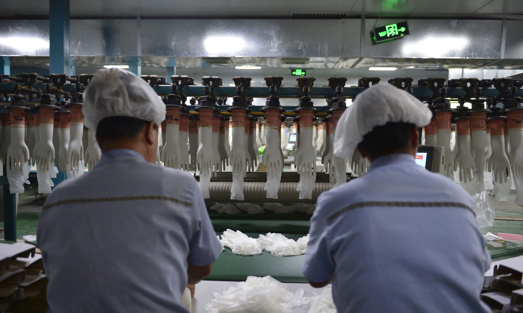 Workers on the disposable glove production line. Photo by Song Qiuju/123rf