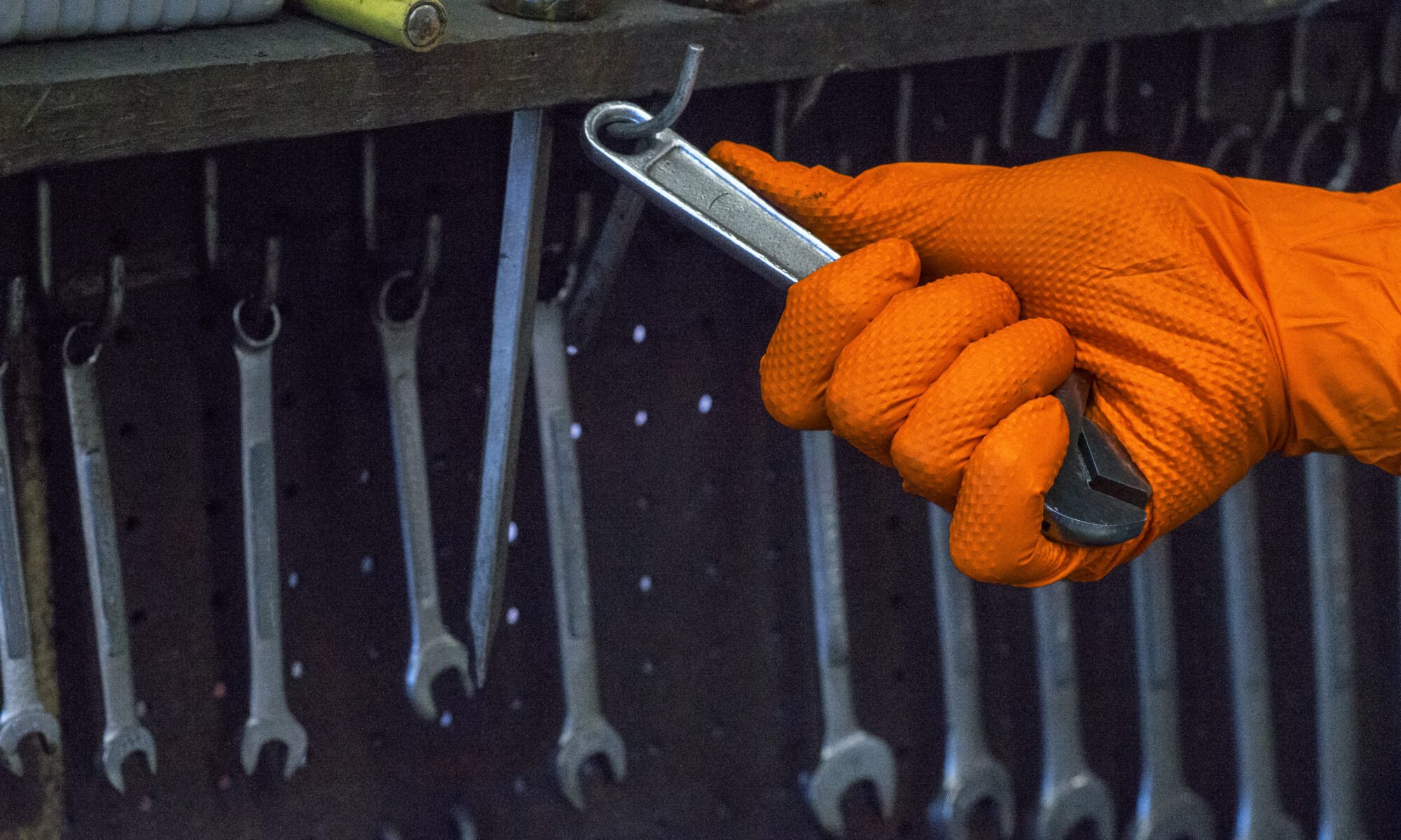 Gloveworks orange nitrile gloves with raised diamond texture